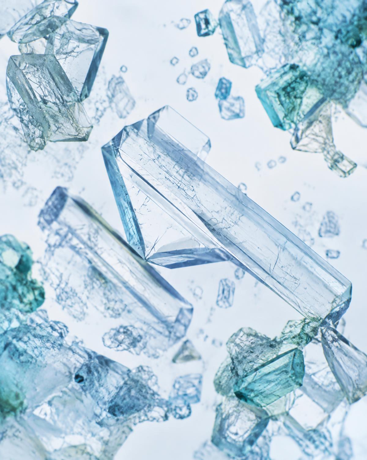 Macro view of translucent crystalline compound in cool blue light